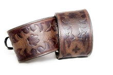 Load image into Gallery viewer, Handmade cuff bracelet, brown leather with vintage look. Hand tooled viking design, Silver eyelets and black kangaroo lace 2 ways of tying to accommodate for different sizes. 
